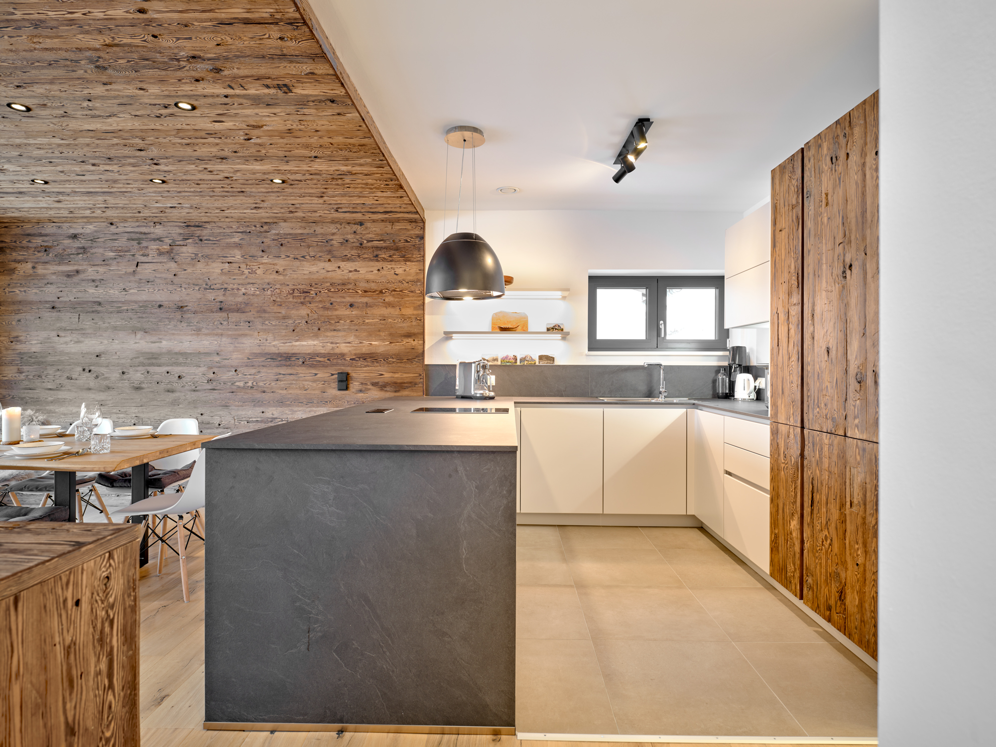 A dark slate counter and reclaimed larch in the kitchen